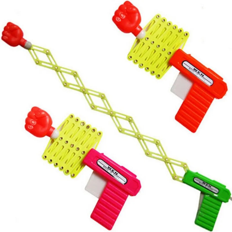 Pugno retrattile sparatutto trucco pistola giocattolo divertente bambino scherzo giocattoli bambini plastica Festival regalo per divertimento classico elastico Anti Stress giocattolo