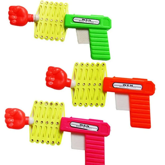 Pugno retrattile sparatutto trucco pistola giocattolo divertente bambino scherzo giocattoli bambini plastica Festival regalo per divertimento classico elastico Anti Stress giocattolo